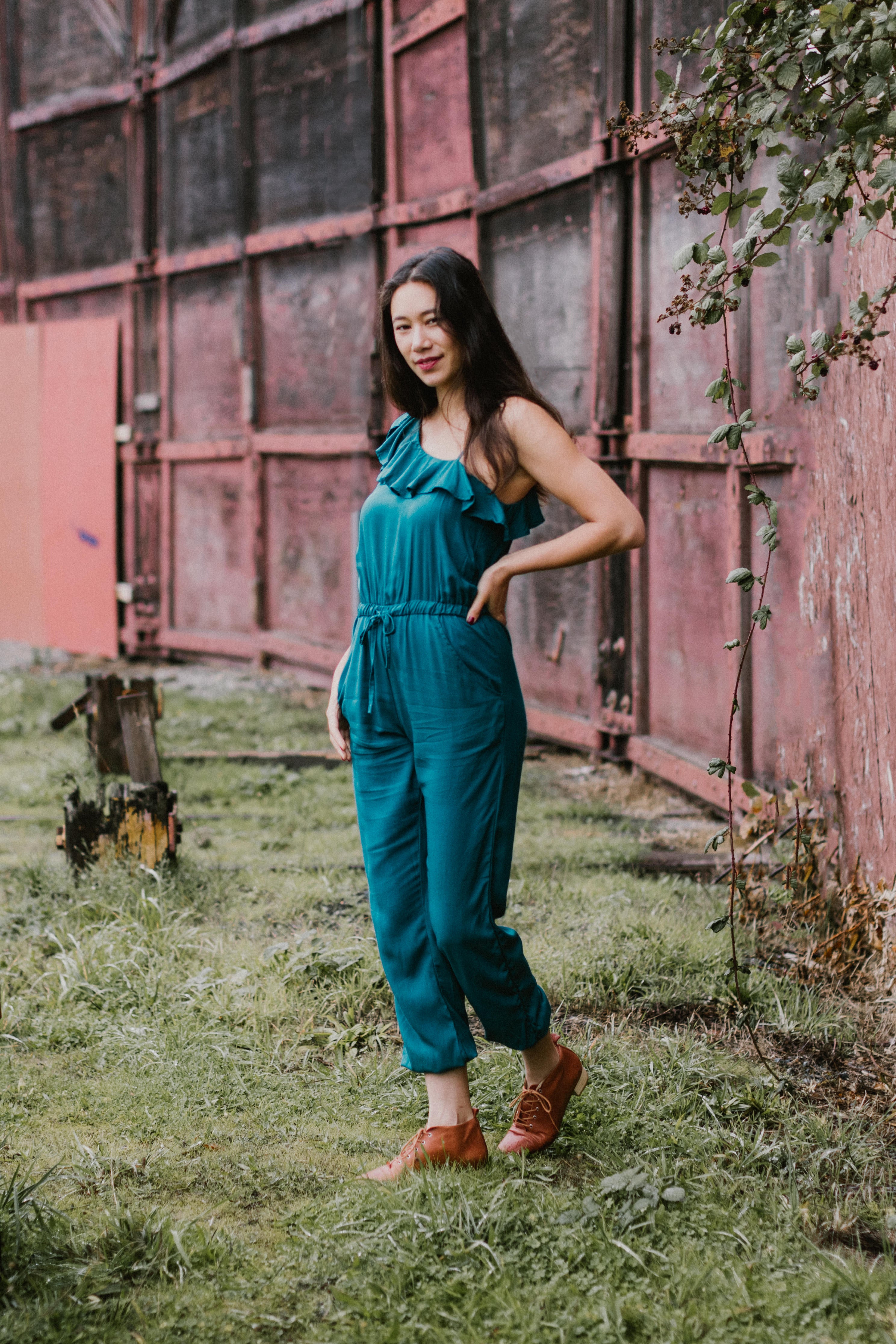Beautiful Young Woman Is Posing In Jumpsuit And High Heels Stock Photo -  Download Image Now - iStock